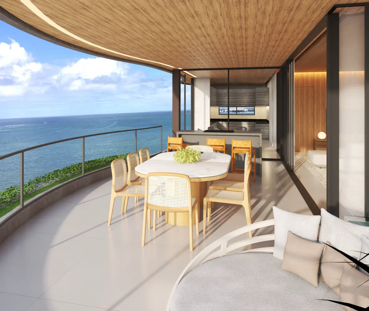 Varanda do América Veiga com mesa e vista para o mar